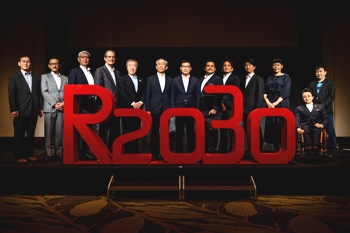 The Academy directors stand in front of an R2030 3D sign 