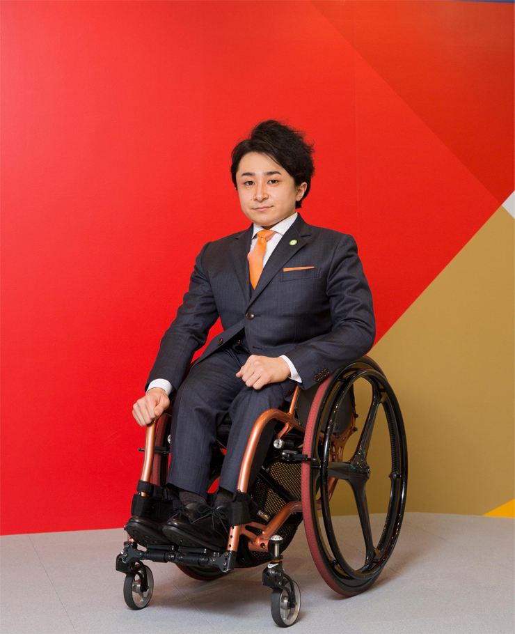 Diversity and disability in Japan - Toshiya Kakiuchi Japanese businessman specializing in breaking down barriers and creating inclusive environments accessible to all - full shot