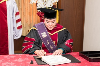 Princess Lalla Hasnaa also signed papers at the end of the ceremony 