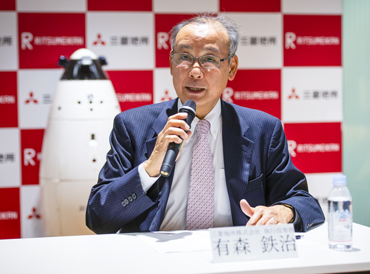 Executive Vice President Tetsuji Arimori speaks to the press