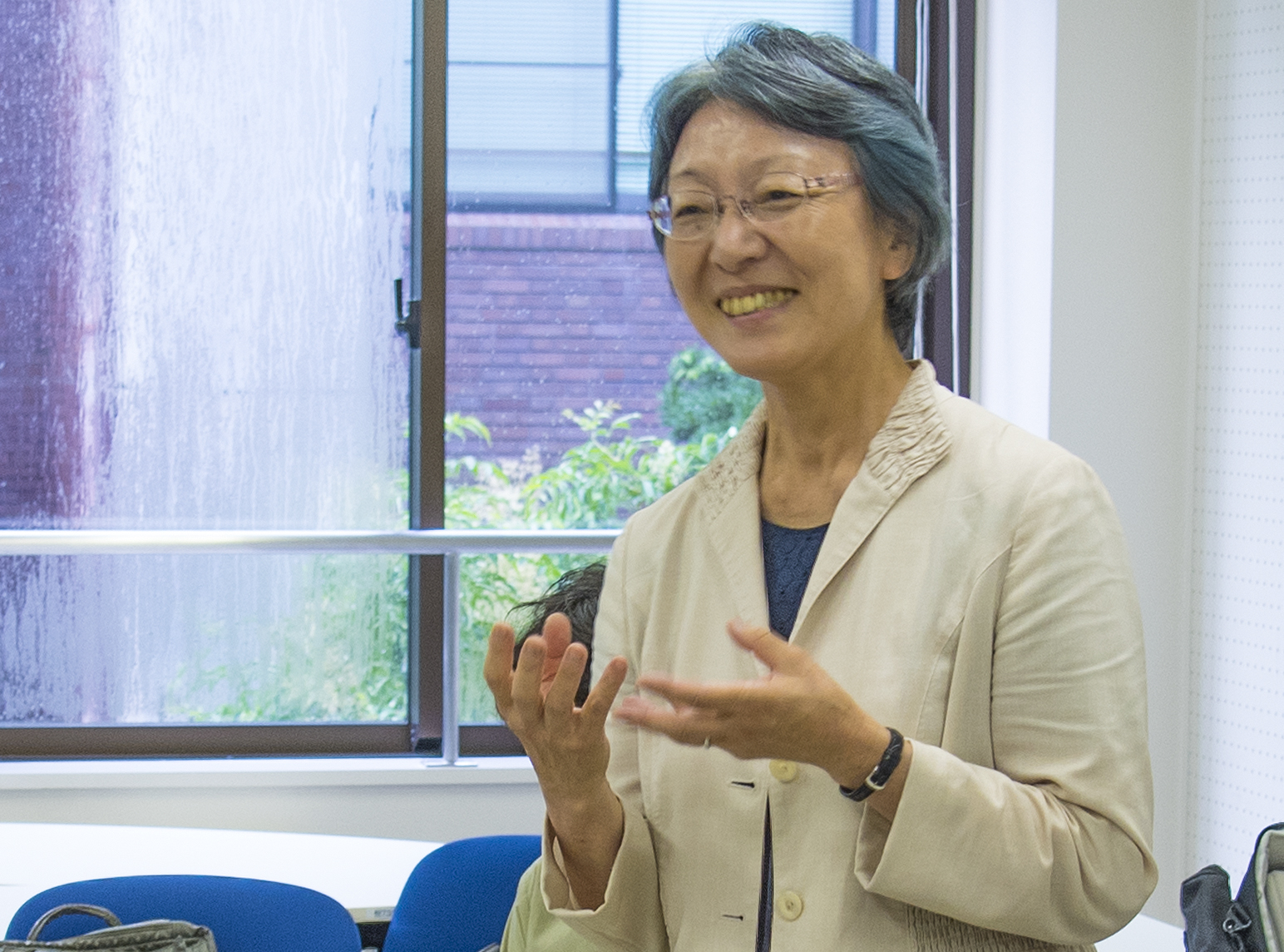 The first female dean of the College of International Relations at Ritsumeikan University smiles broadly