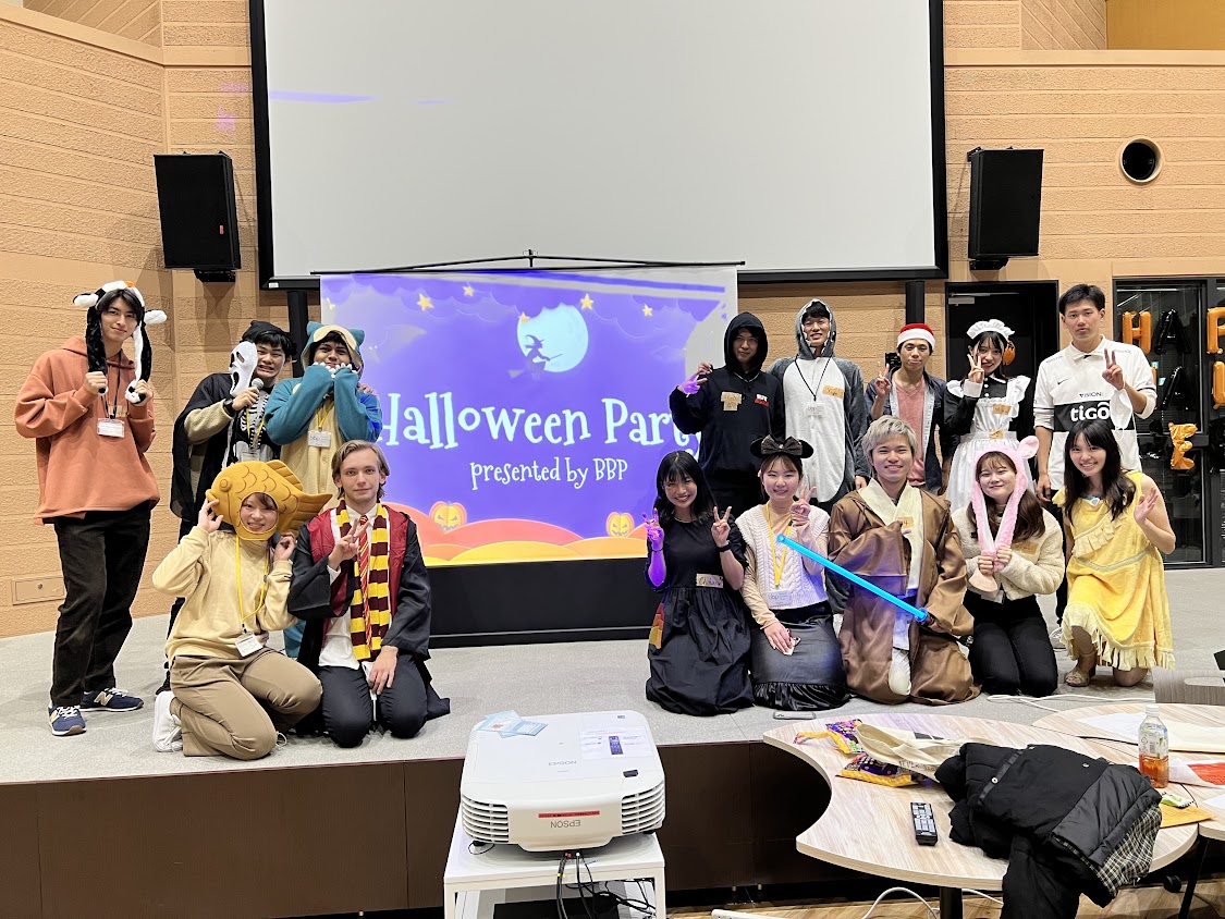 Students dressed in Halloween costumes enjoying a photo op