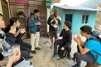 Talking to villagers during a trek