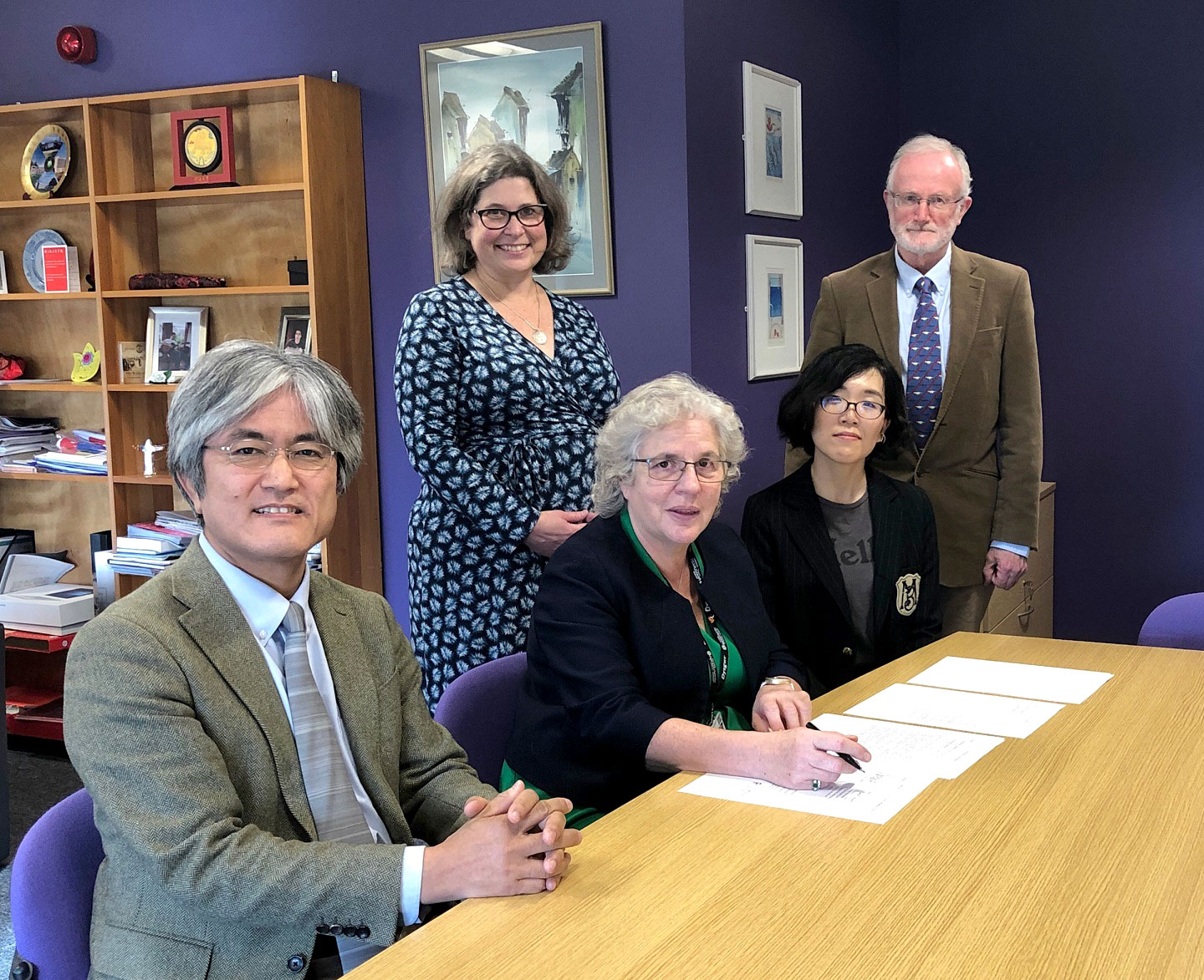 The signing of the agreement at Aberystwyth University