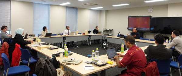 Attendees discussing specific issues in Section 1 of the Colloquium