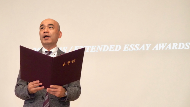 Principal delivering the address at the ceremony