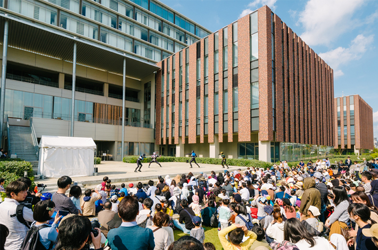 Ritsumeikan University College Festival on Osaka Ibaraki Campus - Power Rangers from afar entertain a young crowd 
